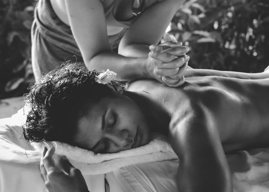Black and white photo of a woman getting a massage